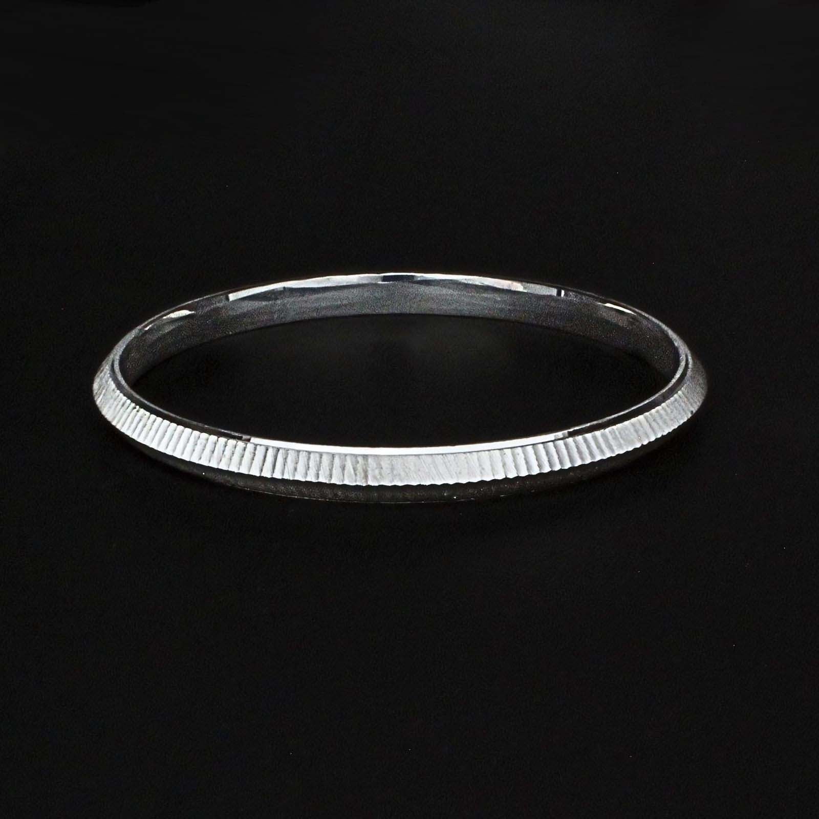 Designer pure chandi ka kada for men | Men's silver bangle on a black background