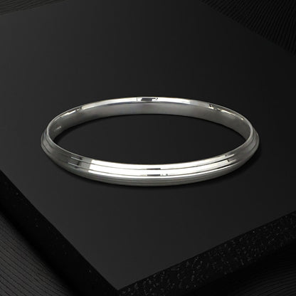 Silver kada for men on a black box