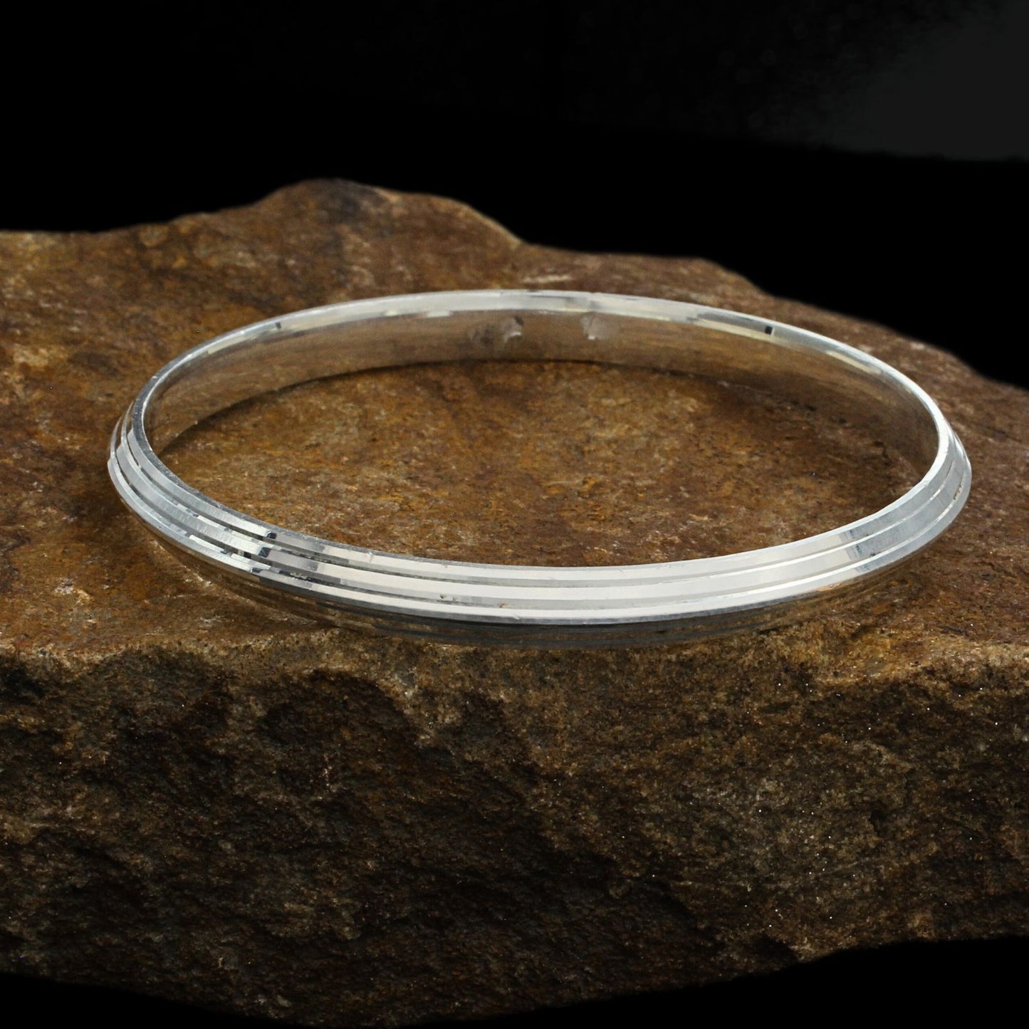 Silver kada for men with a mirror like finishing.