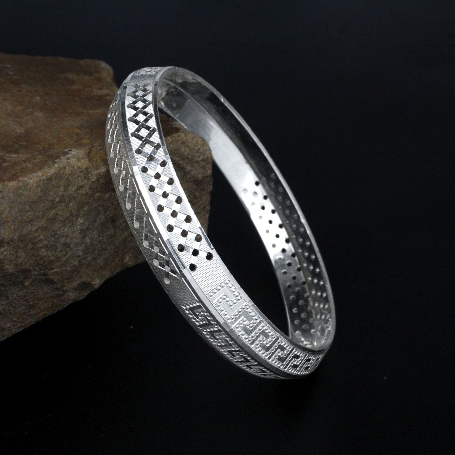 Real Silver Men's Bangle with a unique pattern engraved on it