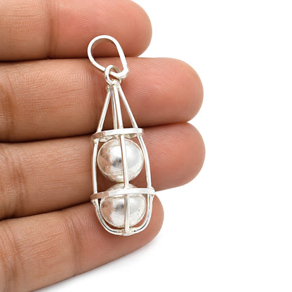 Silver Cage Double Ball Healing Pendant – Nazar Shield Evil Eye Protection Yantra